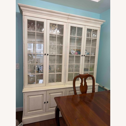 Used Ethan Allen Natural Wood Tall Dining Cabinet for sale on AptDeco