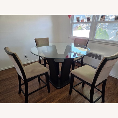 Used Round Dining Table with Chairs for sale on AptDeco