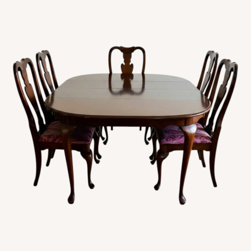 Used Thomasville Oval Cherry Wood Dining Set for sale on AptDeco