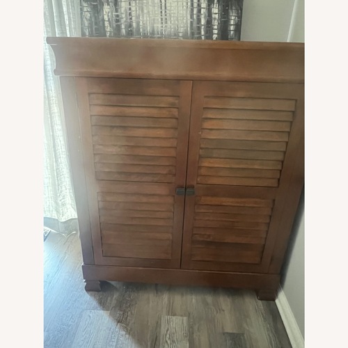 Used Pottery Barn Natural Wood Armoire for sale on AptDeco
