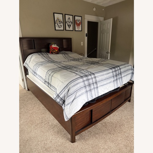 Used Rooms To Go Dark Brown Wood Queen Bed for sale on AptDeco