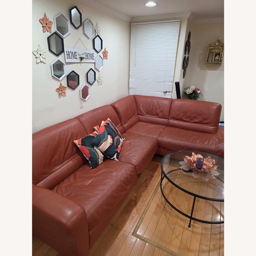 Used Macy's Orange Leather 2 Piece Sectional for sale on AptDeco