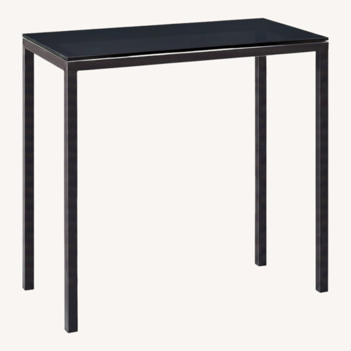 Used Room & Board Black Stainless Steel Dining Table for sale on AptDeco