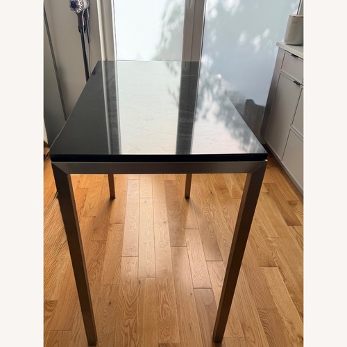Used Room & Board Black Stainless Steel Dining Table for sale on AptDeco