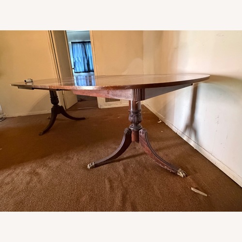 Used Vintage/Antique Dark Brown Wood Dining Table for sale on AptDeco