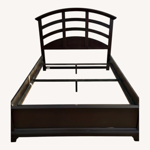 Used Raymour & Flanigan Dark Brown Wood Queen Bed for sale on AptDeco