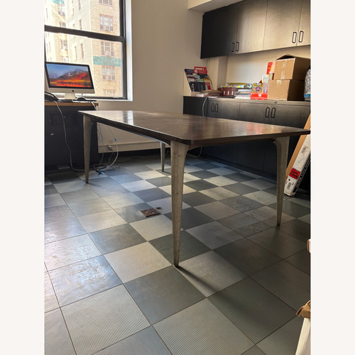 Used Dark Brown Wood Dining Table W Sculpted Legs for sale on AptDeco