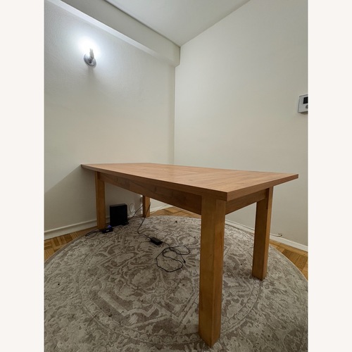Used Home Depot Natural Wood Dining Table for sale on AptDeco