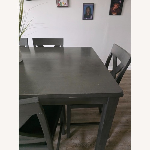 Used Ashley Furniture Dark Gray/Brown Wood Dining Set for sale on AptDeco
