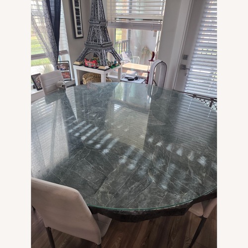 Used Arhaus Dark Gray Wood Dining Table for sale on AptDeco