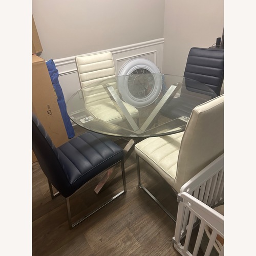 Used Rooms To Go Table Set with 4 Chairs  for sale on AptDeco