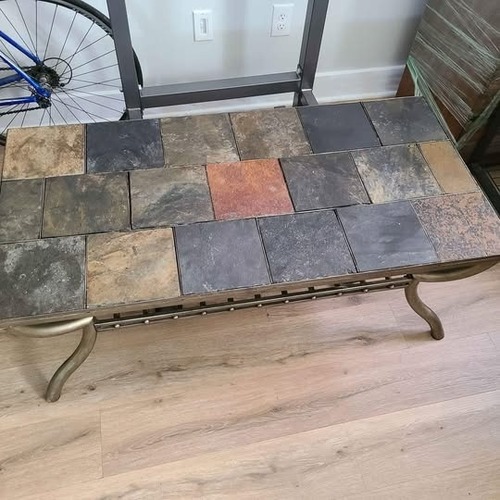 Used Ashley Furniture Antigo Natural Stone Coffee Table for sale on AptDeco