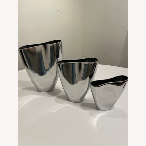 Used Set of 3 Polished Aluminum Decoative Vases for sale on AptDeco