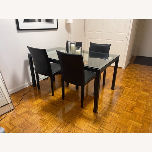 Used Dining Table with Glass Top and 4 Leather Chairs for sale on AptDeco