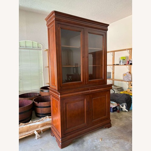 Used Vintage/Antique Finds Dark Brown Wood Armoire for sale on AptDeco