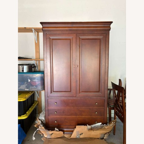 Used Vintage/Antique Finds Dark Brown Wood Armoire for sale on AptDeco