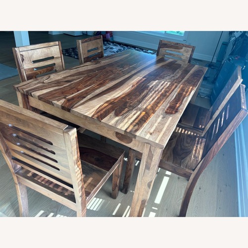 Used Light Brown Solid Wood Dining Table for sale on AptDeco
