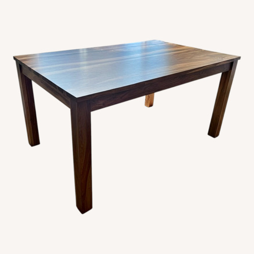 Used Light Brown Solid Wood Dining Table for sale on AptDeco