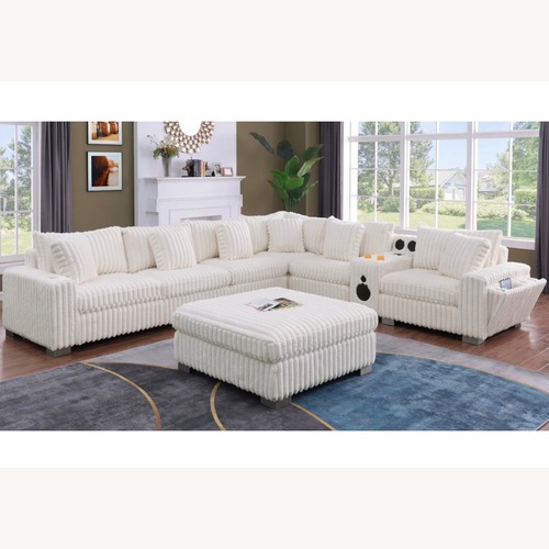 Used  7 Piece Cream Modular Sectional with Console  for sale on AptDeco