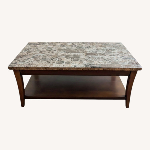 Used Raymour & Flanigan Dark Brown Marble Coffee Table for sale on AptDeco