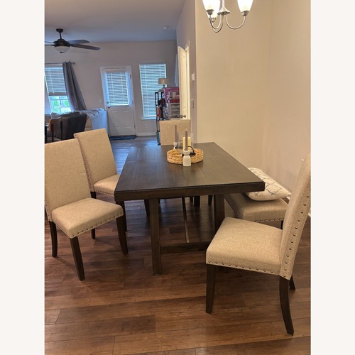 Used Ashley Furniture Dark Brown Wood Dining Set  for sale on AptDeco