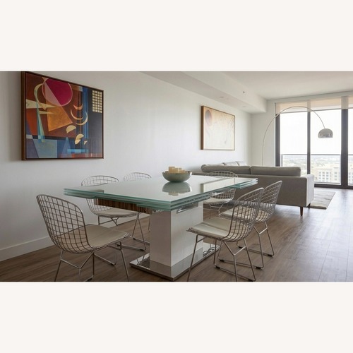 Used Motorized Extendable Dining Table with Top Chairs for sale on AptDeco