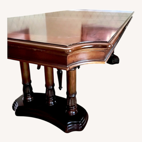 Used Dark Brown Solid Wood Dining Table for sale on AptDeco
