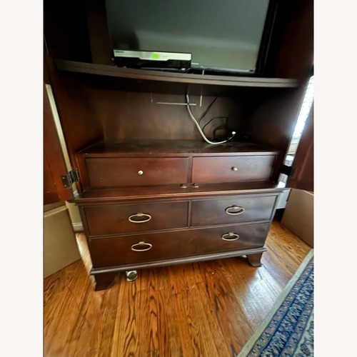 Used Vintage/Antique Dark Cherry Wood Armoire for sale on AptDeco