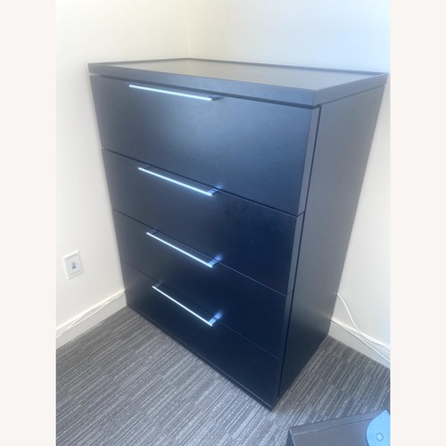 Used Black 4-Drawer Wood Chest for sale on AptDeco