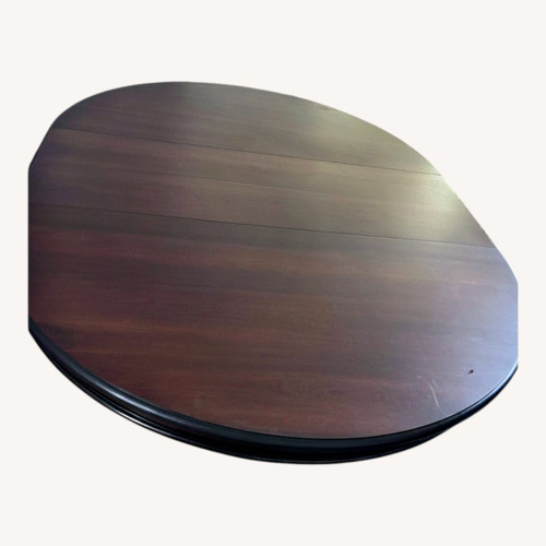Used Dark Brown Wood Dining Table for sale on AptDeco