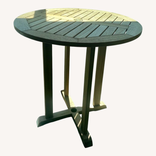 Used Goster Light Brown Outdoor Dining Table for sale on AptDeco