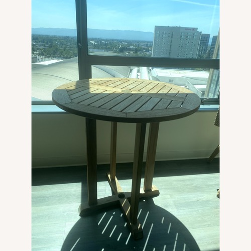 Used Goster Light Brown Outdoor Dining Table for sale on AptDeco