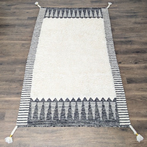 Used West Elm Ikat 5'x8' Black and White Shag Rug  for sale on AptDeco