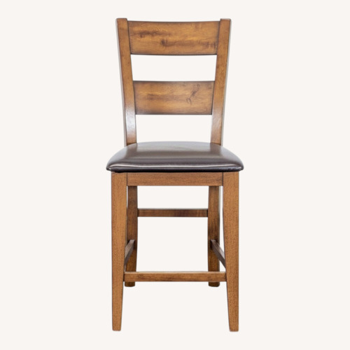 Used Wooden Bar Stool with Faux Leather Seat	 for sale on AptDeco