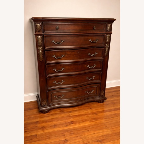 Used Ashley Dark Cherry Wood Chest Dresser for sale on AptDeco