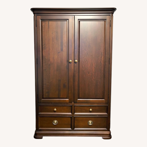 Used Dark Brown Wood Armoire  for sale on AptDeco