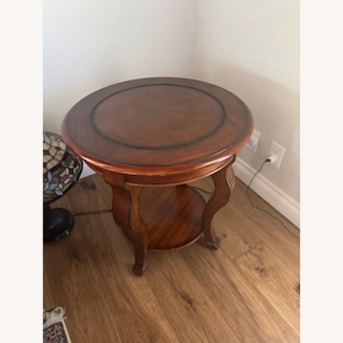 Used Round Wood End Table with Shelf	 for sale on AptDeco
