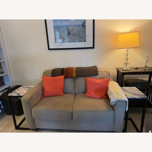 Used Ashley Furniture Beige Loveseat - Comfortable for sale on AptDeco