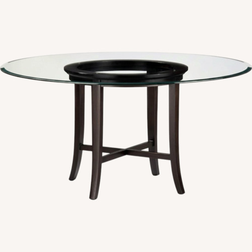 Used Glass Top Round Dining Table on Wood Base for sale on AptDeco