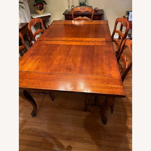 Used Woodbridge Home Designs Dark Brown Dining Set for sale on AptDeco
