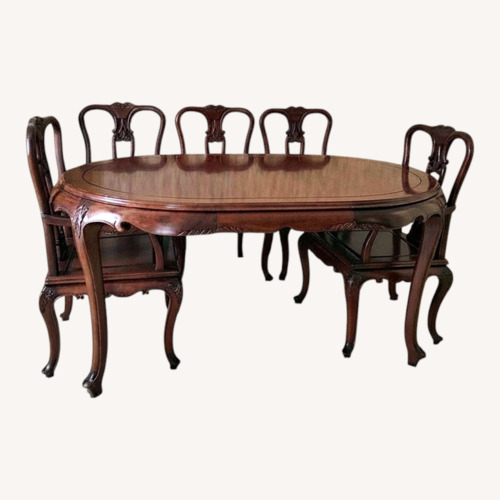 Used Solid Wood Hand Crafted Dining Table and 8 Chairs for sale on AptDeco
