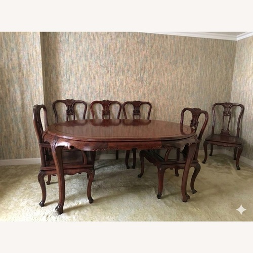 Used Solid Wood Hand Crafted Dining Table and 8 Chairs for sale on AptDeco