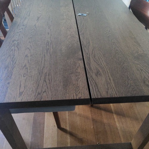 Used Wood Sled Base Dining Table for sale on AptDeco