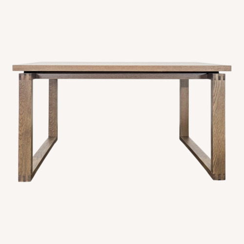 Used Wood Sled Base Dining Table for sale on AptDeco