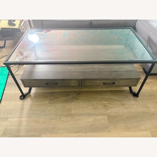 Used Glass Top Coffee Table with Drawers	 for sale on AptDeco