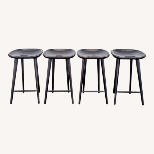 Used Set of Four Wood Saddle Stools	 for sale on AptDeco