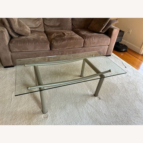 Used Roy & Benot Glass Top Coffee Table on Metal Base for sale on AptDeco