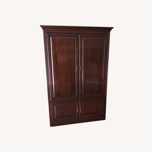 Used Ethan Allen Dark Brown Wood Armoire for sale on AptDeco
