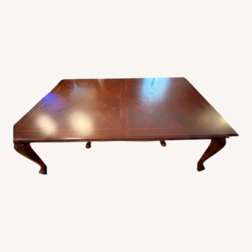 Used Dark Brown Dining Table with 6 Chairs for sale on AptDeco