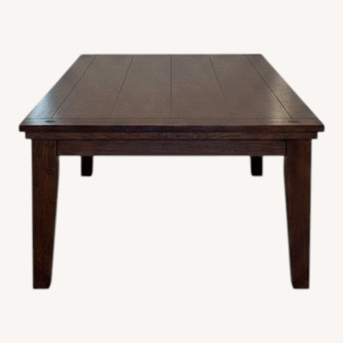 Used Dark Brown Wood Dining Table for sale on AptDeco